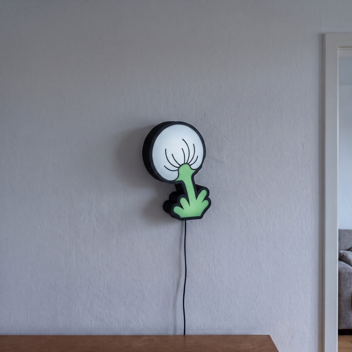 Pusteblume Lampe, an der Wand leuchtend