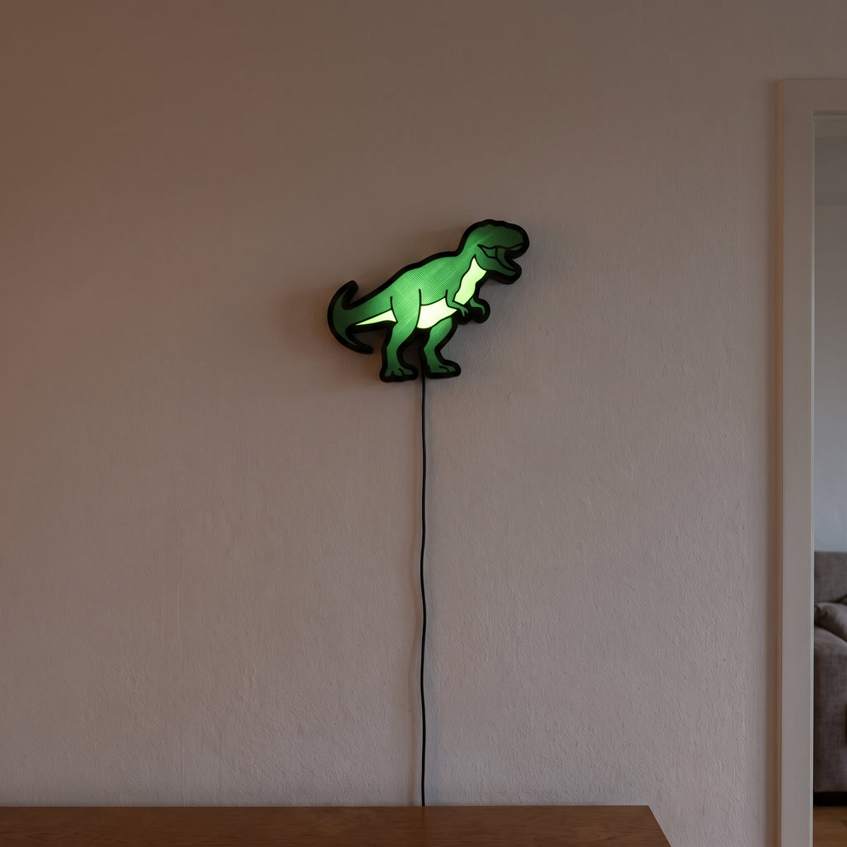 T-Rex Lampe, an der Wand leuchtend