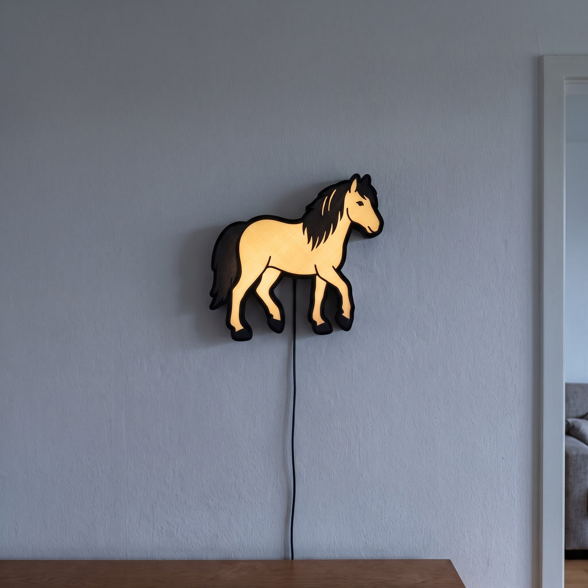 Pony Lampe, an der Wand leuchtend
